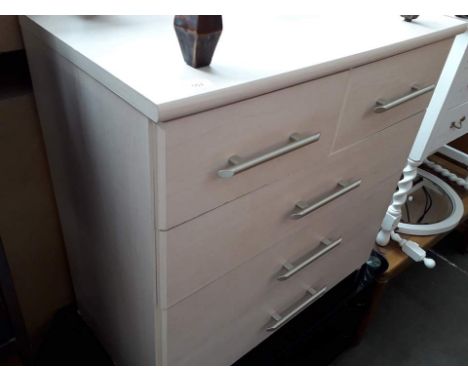 A modern light wood effect chest of drawers 