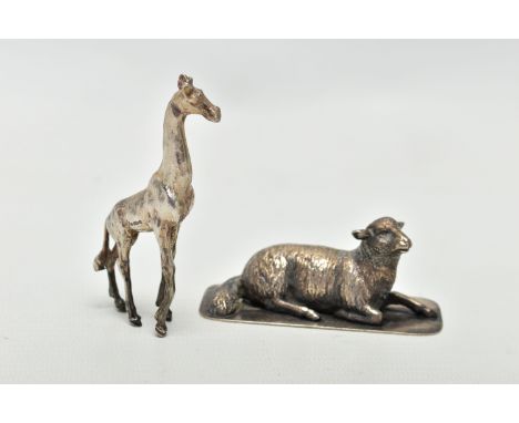 TWO WHITE METAL FIGURES, to include a silver giraff, import marks for London, 1974, approximate length 76mm, approximate gros