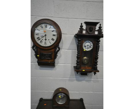 A LATE VICTORIAN WALNUT AND INLAID DROP DIAL WALL CLOCK, with an enamel dial, a walnut Vienna wall clock, and an oak mantle c