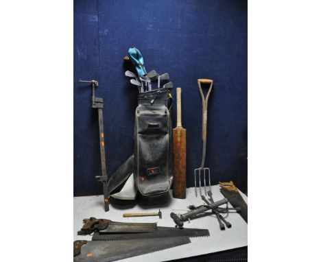 A VINTAGE SPALDING GOLF BAG containing some vintage clubs, along with a vintage cricket bat branded with   dominion driver  ,