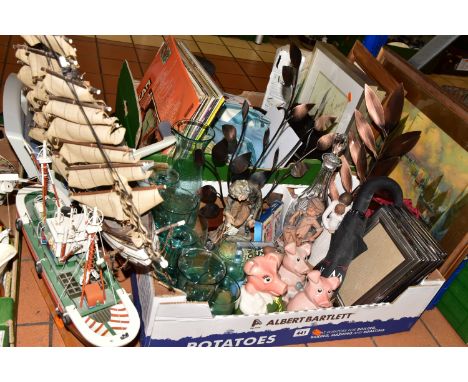 TWO BOXES OF ASSORTED SUNDRIES, to include three Nat West piggies, a cut glass decanter, two wooden model ships, to include '