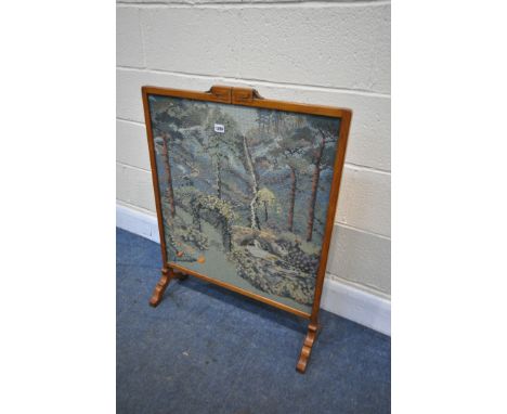 AN ORIENTAL HARDWOOD FIRESCREEN, with needle work landscape, width 65cm x height 86cm (condition - loose beading, torn fabric