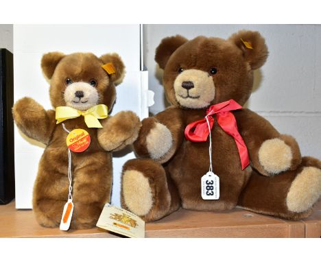 TWO STEIFF BEARS, comprising a boxed light brown bear 023132 with yellow ribbon, gold button, yellow label and paper shop lab