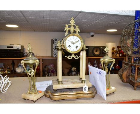 A VICTORIAN FRENCH MARBLE PORTICO CLOCK GARNITURE, with key pendulum and striking bell movement stamped 185, a painted enamel