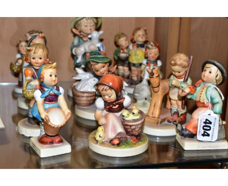 A GROUP OF ELEVEN HUMMEL GOEBEL PORCELAIN FIGURES, comprising 'Little Helper' 75, 'School Boy' 822, 'Surprise' 94, 'Playmates