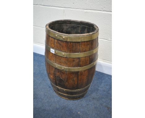 A VINTAGE OAK AND BRASS BANDED STICK BARREL, height 60cm (condition:-banding in need of tightening due to being rickety)