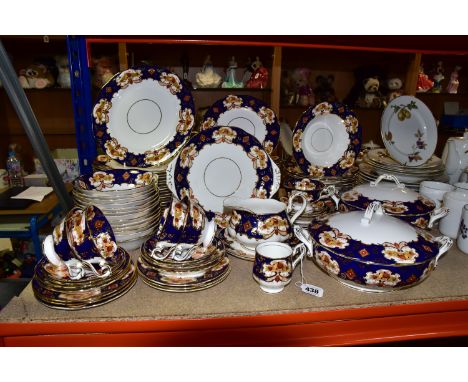 A ROYAL ALBERT 'HEIRLOOM' PATTERN DINNER SET, modern back stamp, comprising two circular covered tureens, gravy jug and stand