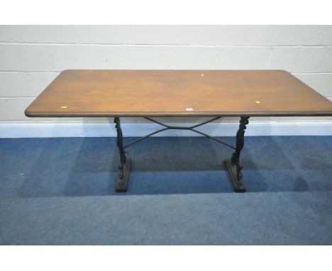 A VINTAGE RECTANGULAR CAST IRON TABLE, with a later wooden top, length 168cm x depth 77cm x height 72cm, width of base, 93cm 