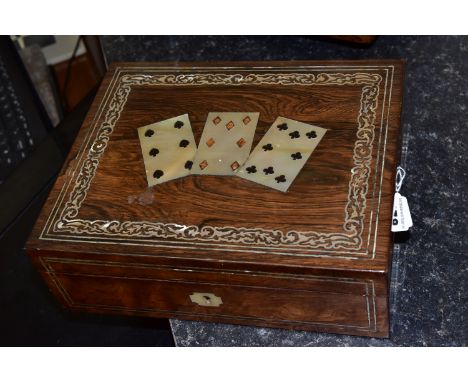 A PLAYING CARD BOX, the hinged lid having three inlaid mother of pearl playing cards inside a foliate border, with mother of 