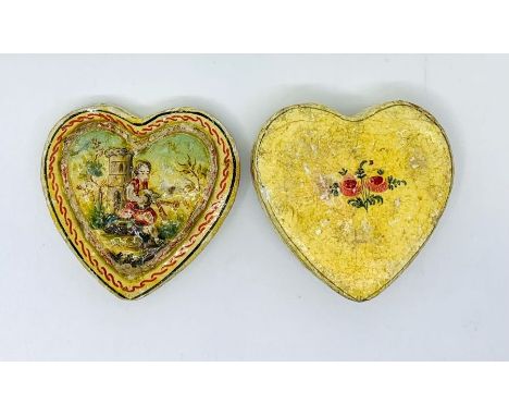 Valentine. A papier-mâché&nbsp;heart-shaped patch box, c.1850, raised detail hand-painted with a boy playing bagpipes before 