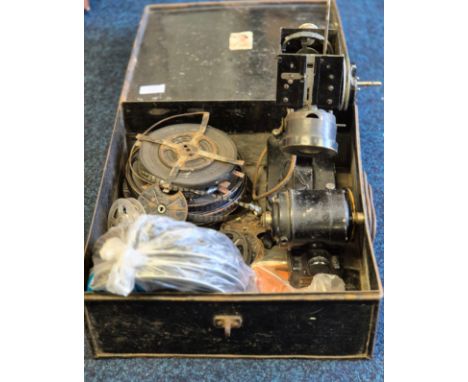 Antique Baby projector and reels. Comes within a metal chest. 