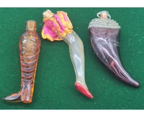 A Collection of three art glass decorative perfume bottles; Two Art glass leg perfume bottles &amp; purple art glass tooth sh