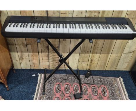 Casio CDP- 120BK Digital Piano with stand. In a working condition.
