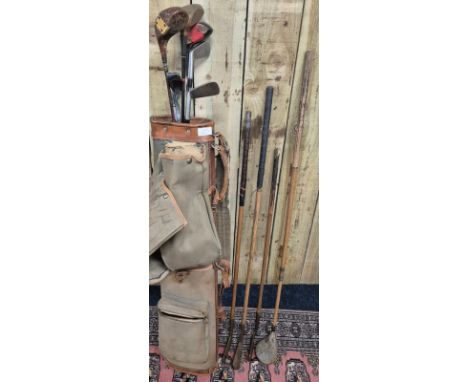 Antique golf bag containing four hickory shaft clubs and the rest metal shaft clubs. Hickories- E. Wilson of St. Andrews, Bra