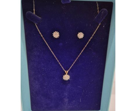 9ct yellow gold diamond cluster pendant with matching earrings. Comes with a 9ct yellow gold necklace. 