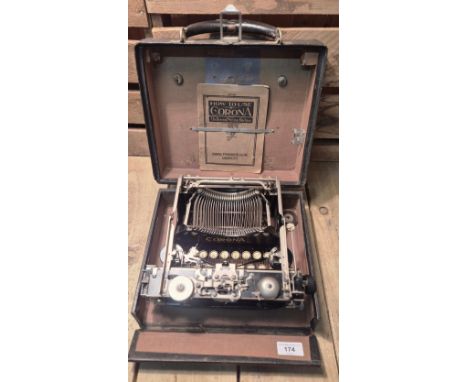 Small Antique Corona portable typewriter. Comes with travel case and manual. 