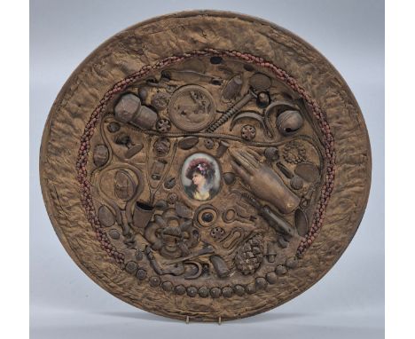 A Very unusual 19th century plate sculpture depicting centre hand painted cameo portrait of a lady, surrounded by various cur