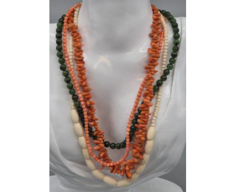 A Selection of vintage necklaces and earrings; Two pink coral necklaces and earrings. Jade necklace and matching earrings. To
