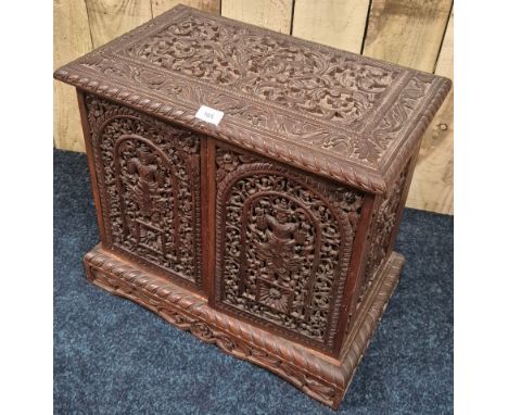 Early 20th Century Burmese two door Multi drawer collectors cabinet with detailed Burmese God Panelling&nbsp;51x55x34cm&nbsp;
