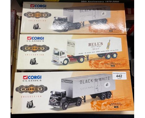 A collection of three Corgi Classics "Whisky" collection truck models Black &amp; white scotch whisky &amp; bells whisky truc