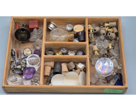 A Collection of Perfume bottle stoppers and spare parts; Includes Bakelite dice lip stick dispenser. Small Cut crystal barrel