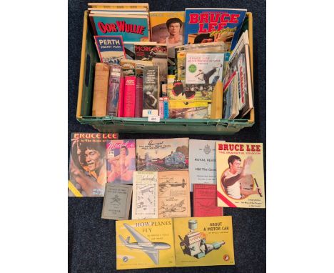 A crate of books, magazines and annuals; More Eves without Leaves photograph studies by Walter Bird Roye John Everard. Model 