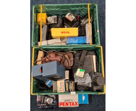 Two crates of cameras and accessories; Pentax MV1 Body. Amstrad VMC 8 Videorecorder. Panasonic Lumix TZ65 Camera. Polaroid ca