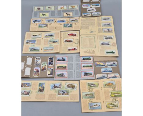 A Large collection of Vintage Cigarette card albums; ships, planes, trains, Industrial &amp; Wildlife cards