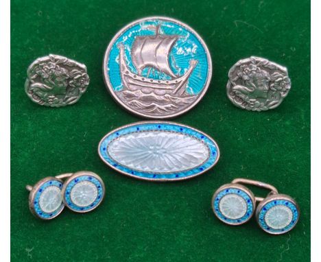 A Selection of Art Nouveau silver jewellery; Pair of silver buttons made into earrings. Silver and enamel long boat brooch- M