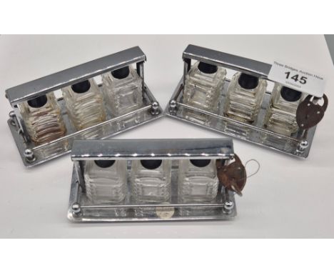 A Collection of three Art deco chrome Plated Perfume Bottle stands in form of Tantalus 