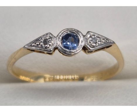 18ct yellow gold &amp; Platinum set ring. Blue Sapphire centre stone &amp; diamond surroundings. 1.35grams. Ring size L. 