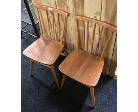A Pair of Ercol Windsor Chairs. Made from elm wood. 