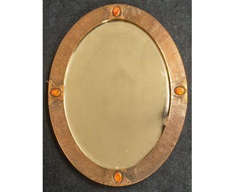 Art Nouveau copper hammered and jewel framed mirror. Oval Form.&nbsp;59x45cm frame