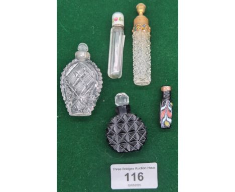A Collection of five Glass vintage perfume bottles; Early 20th century cut-glass scent bottle with a brass jewelled top, earl