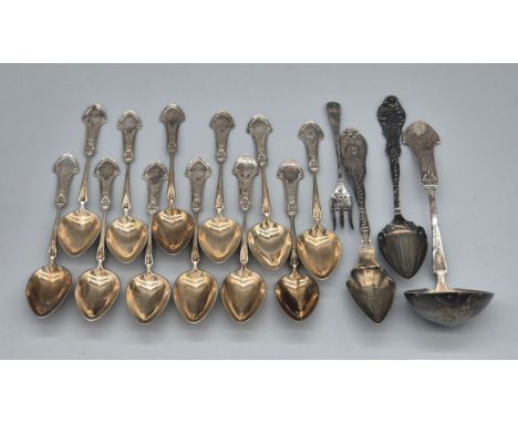 A Collection of Sterling silver flatwares; Set of Twelve Birmingham Silver tea spoons produced by Gorham with matching ladle.