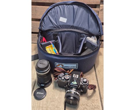Nikon FE2 Camera and lens. Comes with carry bag and accessories 