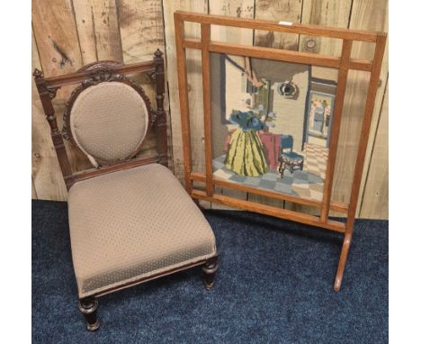 19th century nursing chair together with a tapestry and oak framed fire screen. Details to the reverse of the screen. 