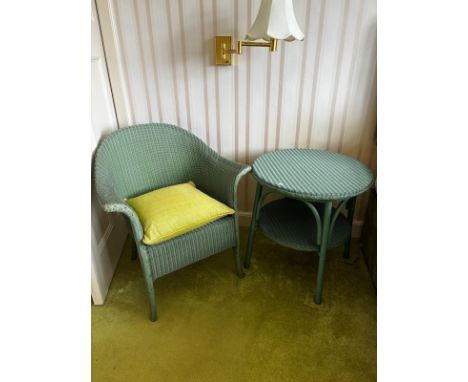 Llyod Loom wicker weaved tub chair and matching side table. Both having original labels to the underside. 