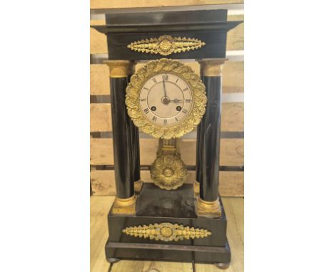 19th Century French Empire Wood and Bronze Mantel Clock With Columns by Guyerdet Aine Paris. 44cm in height. 