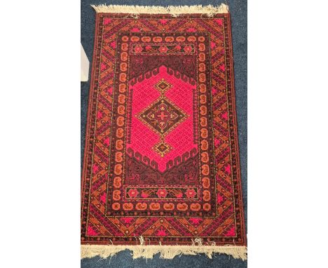 Vintage Indian red ground rug. 155x92cm. 