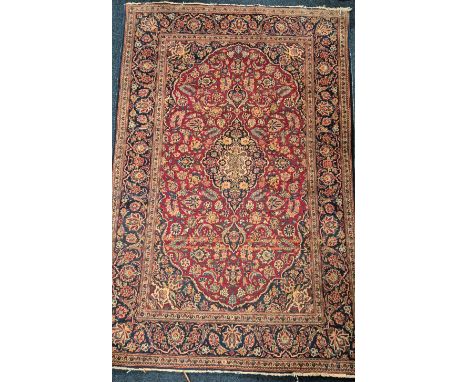Antique Persian hand woven rug. Red Ground. Blue boarder and trims. 203x132cm. 