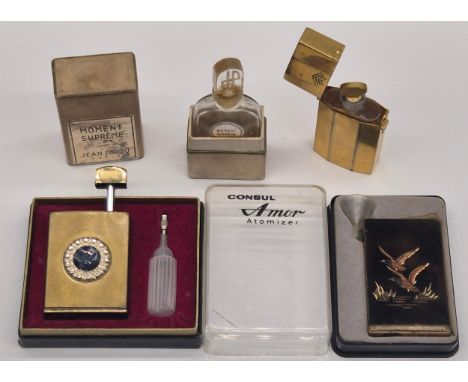 A Collection of Four perfume bottles; Moment Supreme Jean Patou Paris empty art Deco perfume bottle, Houbigant Brass perfume 