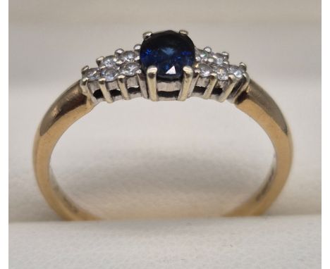 9ct yellow gold, Sapphire and diamond stone ring. 2.16grams. Ring size Q.