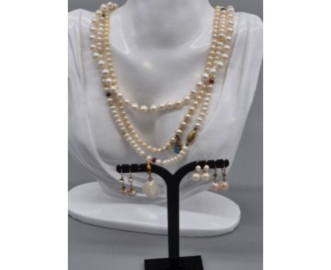 Three 9ct yellow gold and cultured pearl necklaces and earrings. One necklace fitted with a 9ct yellow gold, diamond and blue