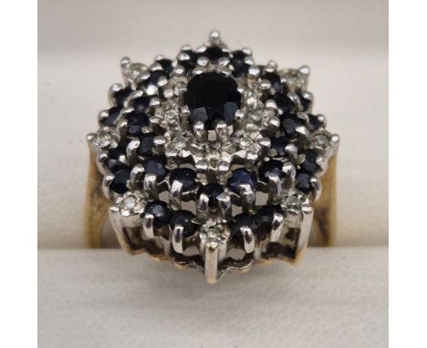 9ct yellow gold diamond and sapphire cluster ring. 5.50grams. Ring size N. 