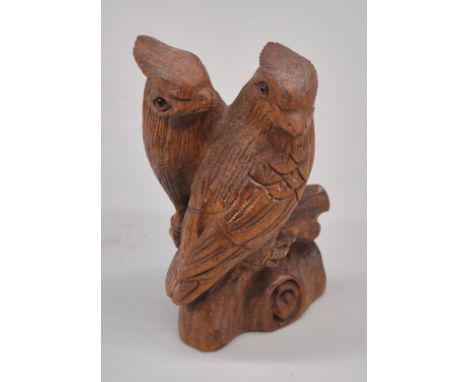 Japanese hand carved Boxwood Netsuke sculpture of two birds perched on a branch. Both having fitted black bead eyes and signe