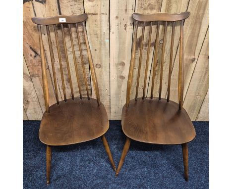 Two Vintage Ercol elmwood spindle back chairs. 