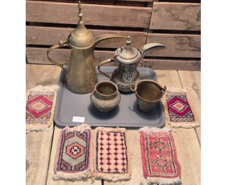 Tray of Arabic coffee pots and other collectables. A Selection of miniature hand made miniature rugs. 