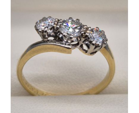 18ct &amp; Platinum diamond stone ring. Three round cut diamonds. 0.70cts. Dated 1939. Ring size O. 3.43Grams. 