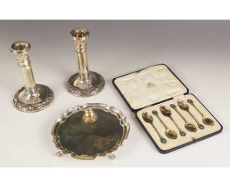 A cased set of six George V silver gilt and enamel coffee spoons , Mappin & Webb, Birmingham 1929, each terminal modelled as 